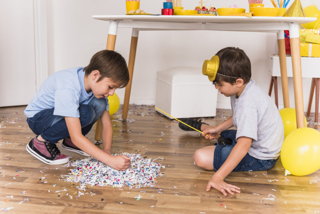 two little friends gathering confetti floor party