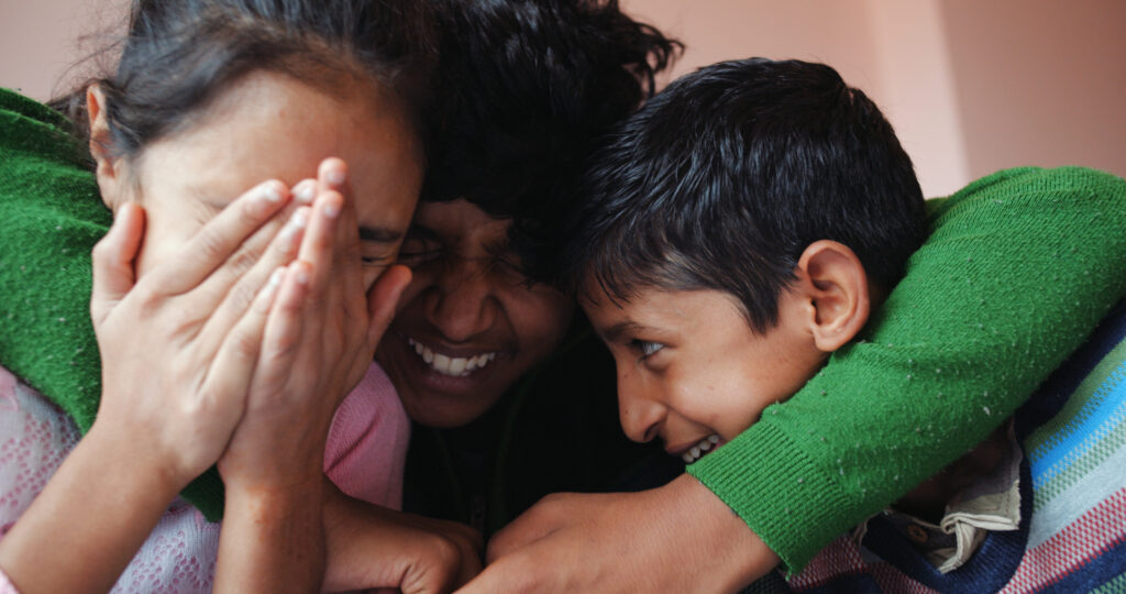 closeup of the group of children laughing together.