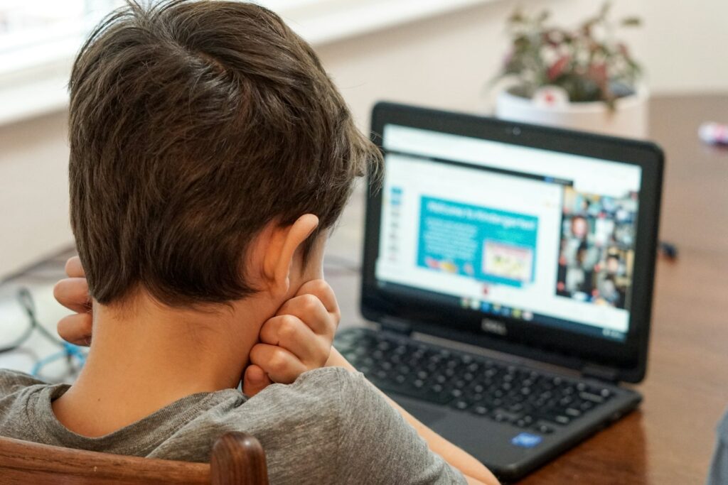 Child attending an online video session at home during teletherapy and online support for special needs children in Bangalore